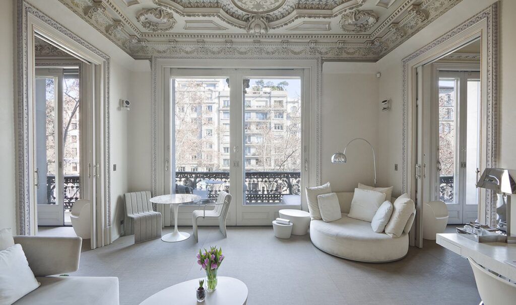 Luxurious hotel suite with exquisite architectural details and elegant furnishings promoting a sense of well-being.